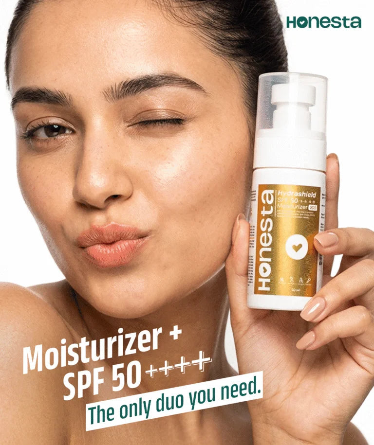 A woman holds a bottle of Honesta Hyaluhydrated Moisturizer + SPF 50++++ in one hand while applying or touching her face with the other. The image features a clean white background, promotional text, and the Honesta brand logo.